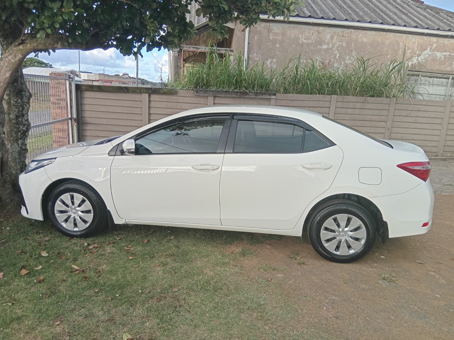 White sedan used for shuttle service